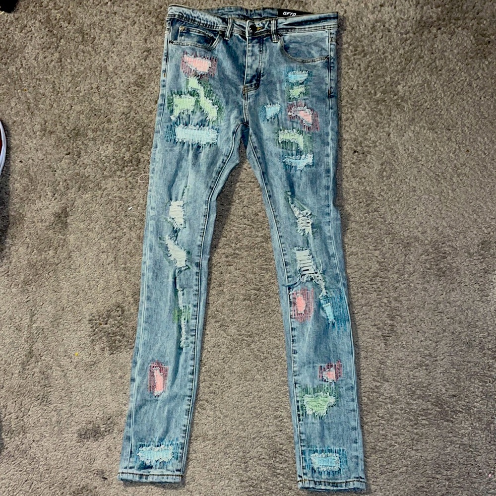 Super skinny jeans, size 32 with the green, pink and blue stitching